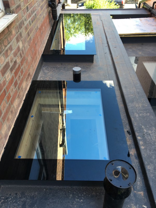 Multiple flat roof skylights on extension in Stanmore