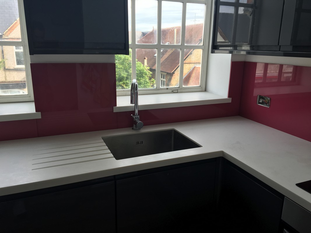 Deep plum coloured glass splashback in modern Stanmore kitchen